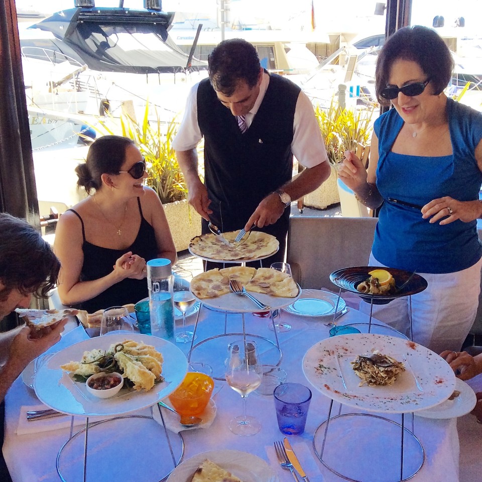 Serving the White Truffle Pizza at African Queen restaurant in Beaulieu-sur-Mer