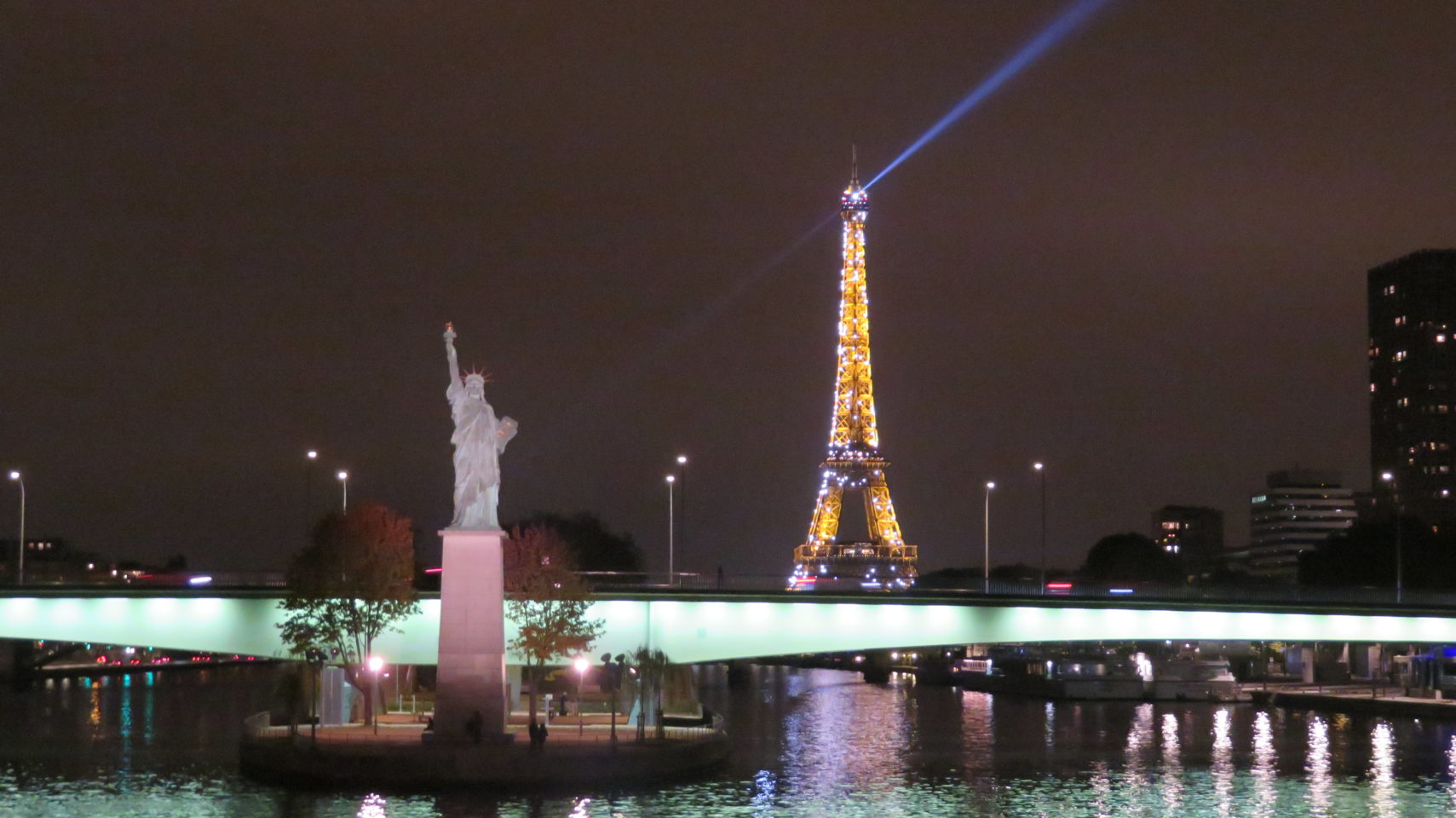 Statue of Liberty and Eiffel Tower at night in Paris, France (Paris and Normandie AMAWaterways Cruise)