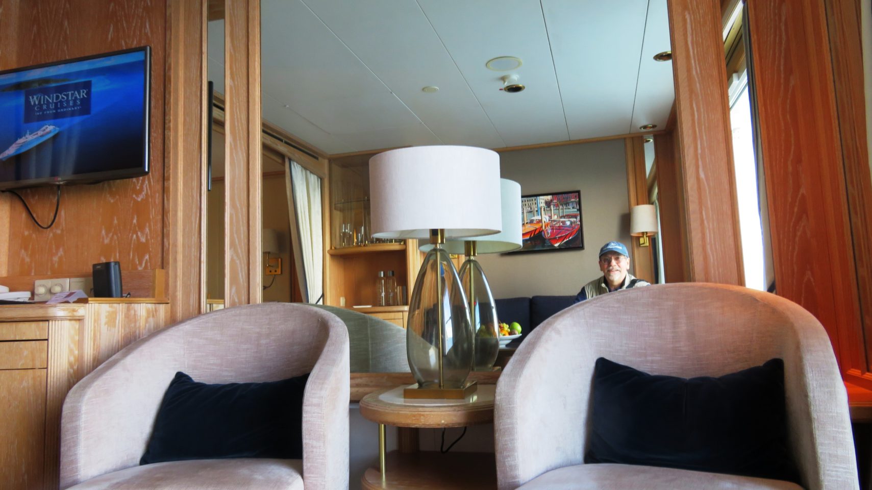 Windstar Cruises ~ Denis enjoying the comfort of the living area of our ideal cabin