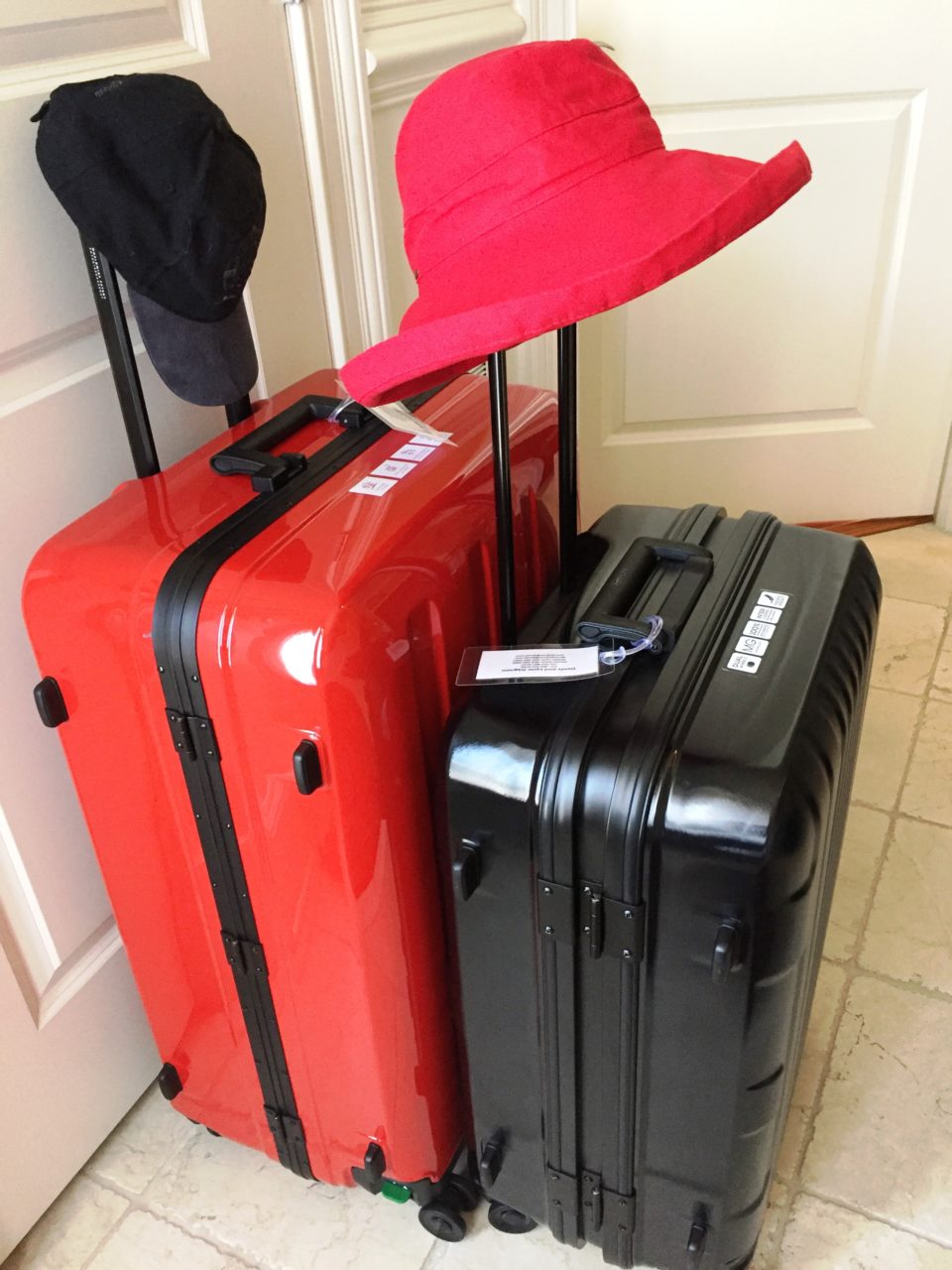 Lojel Luggage ~ Red Lojel Novigo and black Lojel Kozmos suitcases