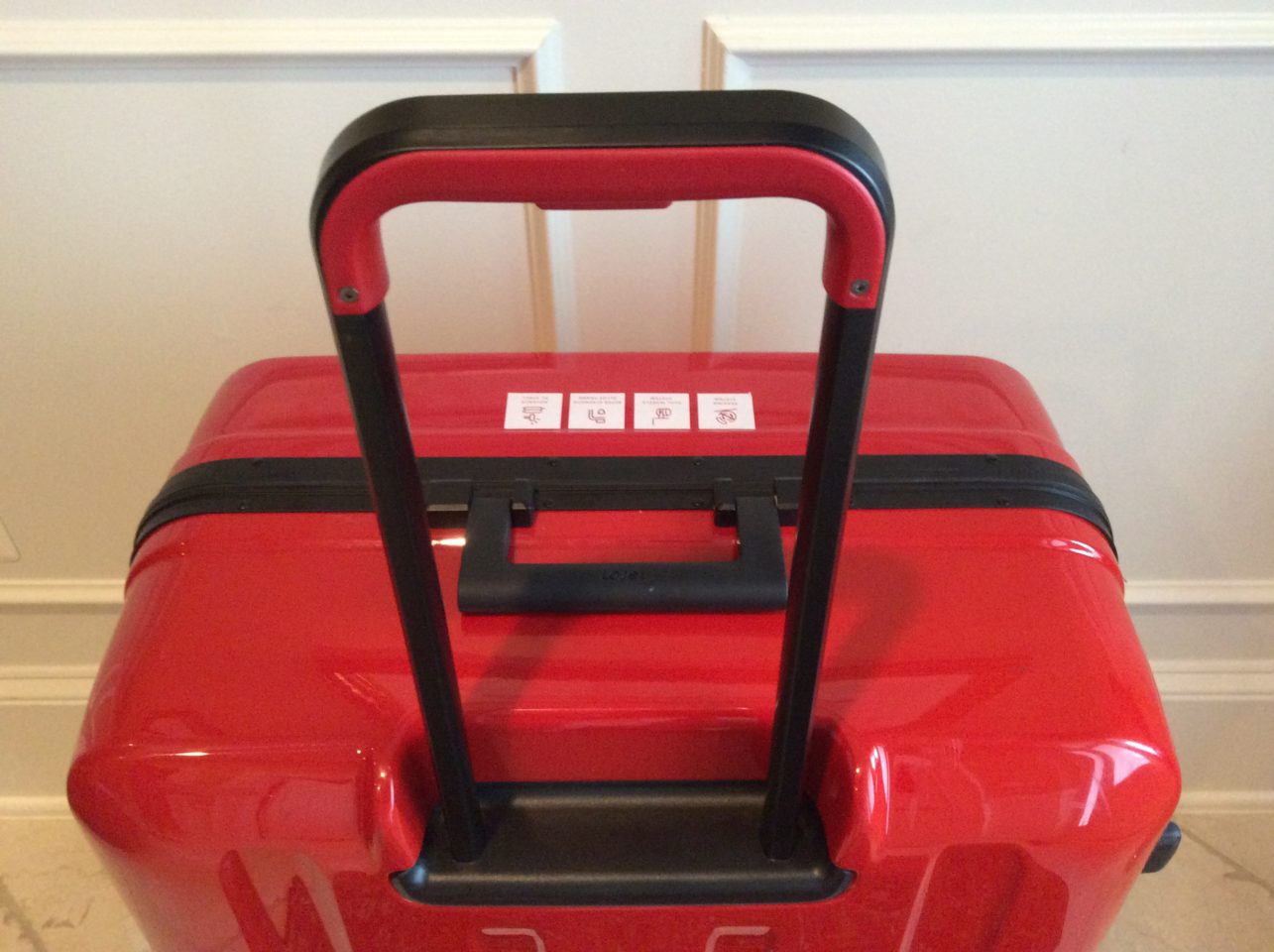 Lojel Luggage ~ Sturdy telescoping handle and one-piece trolley system